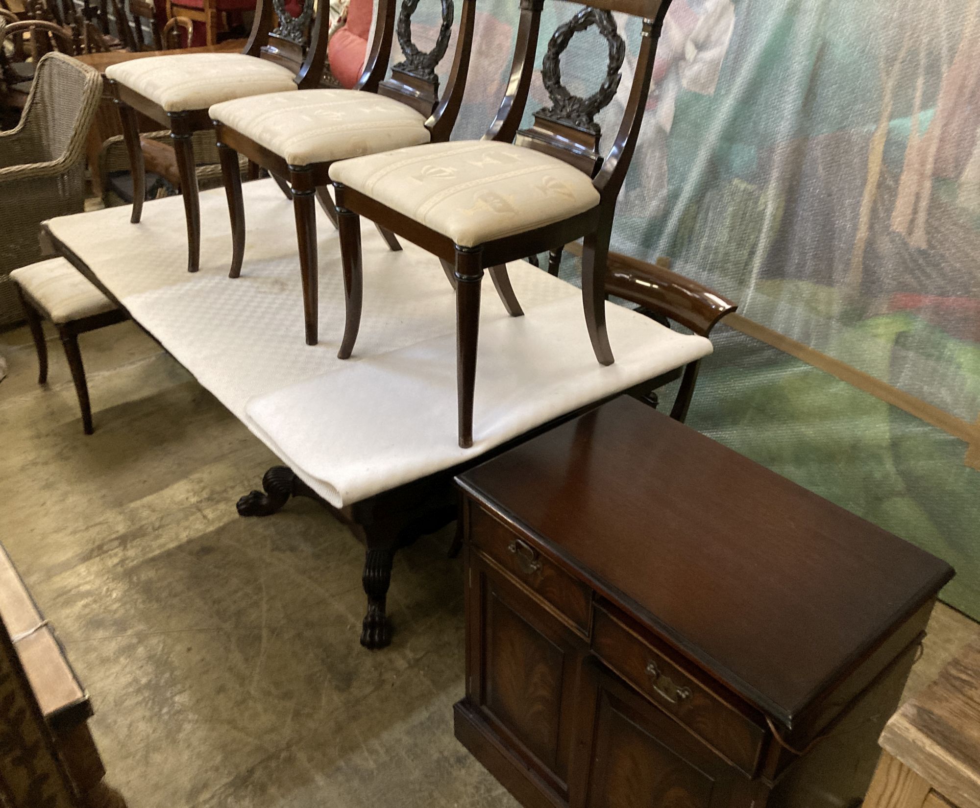 A Regency style mahogany dining suite, comprising rectangular dining table, 176cm extended (one spare leaf), six chairs and a side cabi